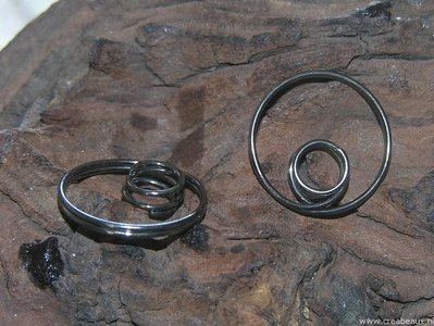 Ring om kralen tussen te klemmen, 22x24mm, black nickelkleur